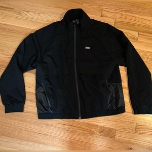 Black womens figs jacket. Size large. Never worn.